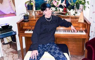 Here is an image of Yesim sitting in front of a piano looking cool.